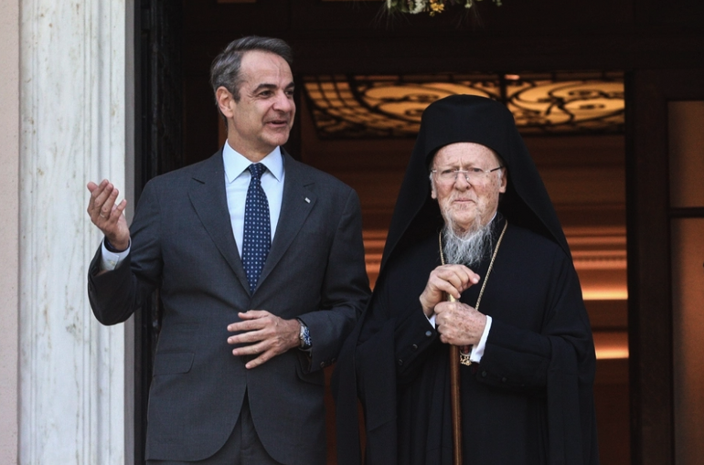 oikoymenikos mitsotakis